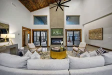 Modern luxury living area in II Elks Lodge, Broken Bow, Oklahoma, featuring a floor-to-ceiling concrete