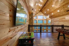 Red Baron Lodge patio seating area surrounded by trees